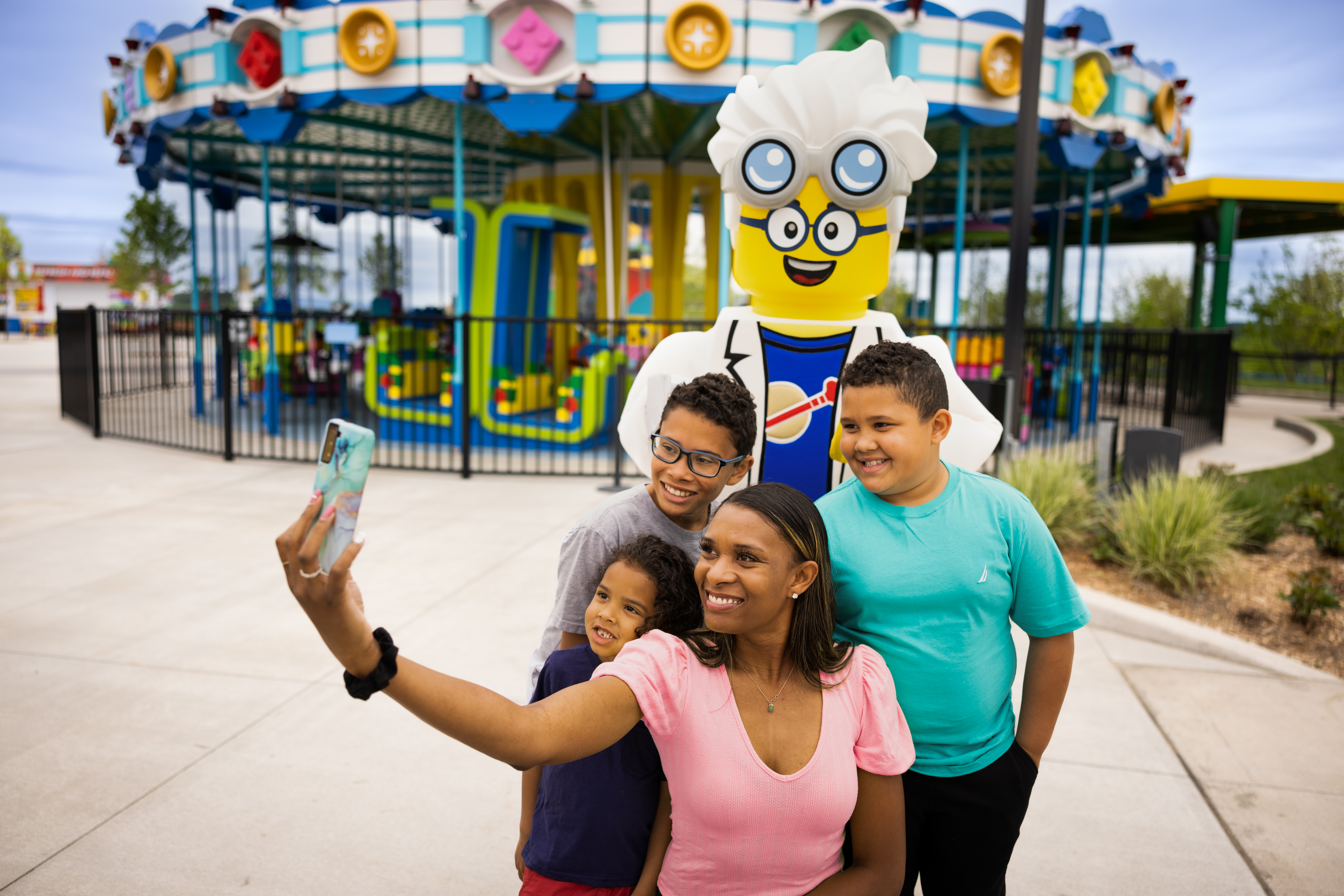 Family taking a selfie with Minifigure Character at LEGOLAND New York