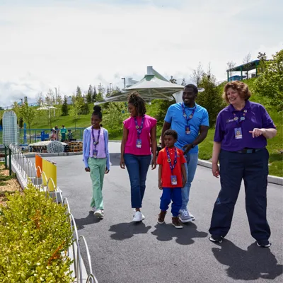 Family walking through MINILAND with VIP Host at LEGOLAND New York