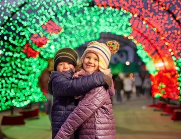 Kids under Light Tunnel during Holiday Bricktacular 
