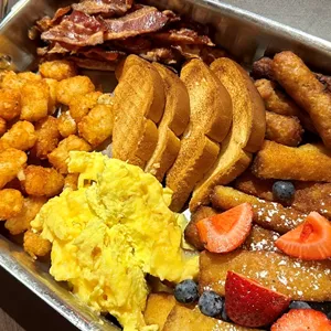 Enjoy free breakfast at the LEGOLAND Hotel including french toast sticks, bacon, and eggs