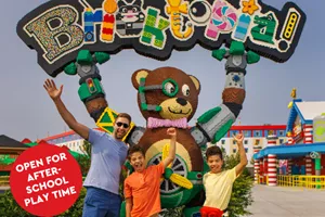 Family in front of BRICKTOPIA sign
