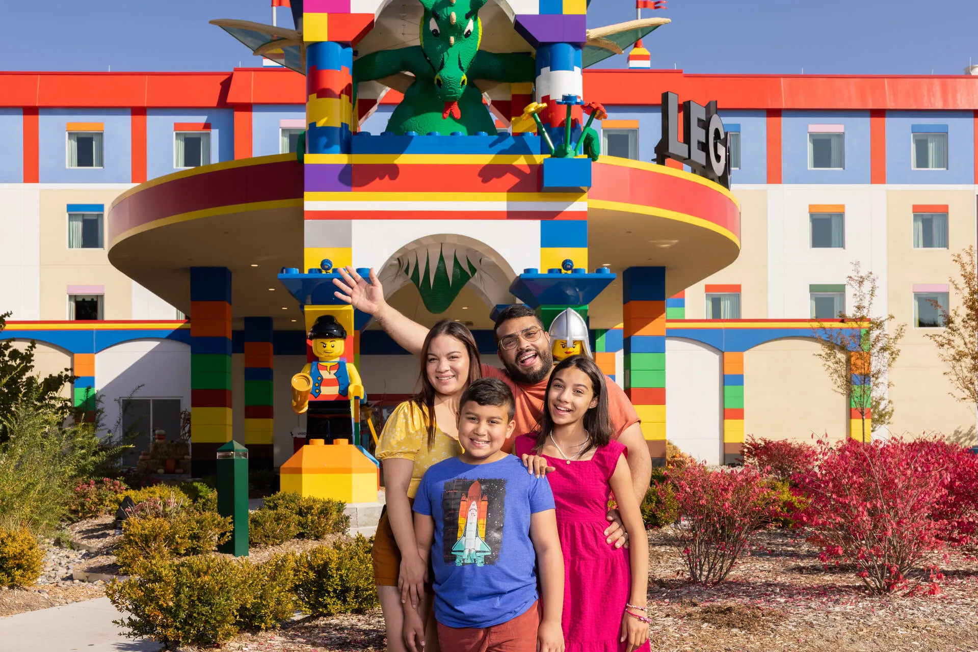 Family poses for a photo at the LEGOLAND Hotel entrance