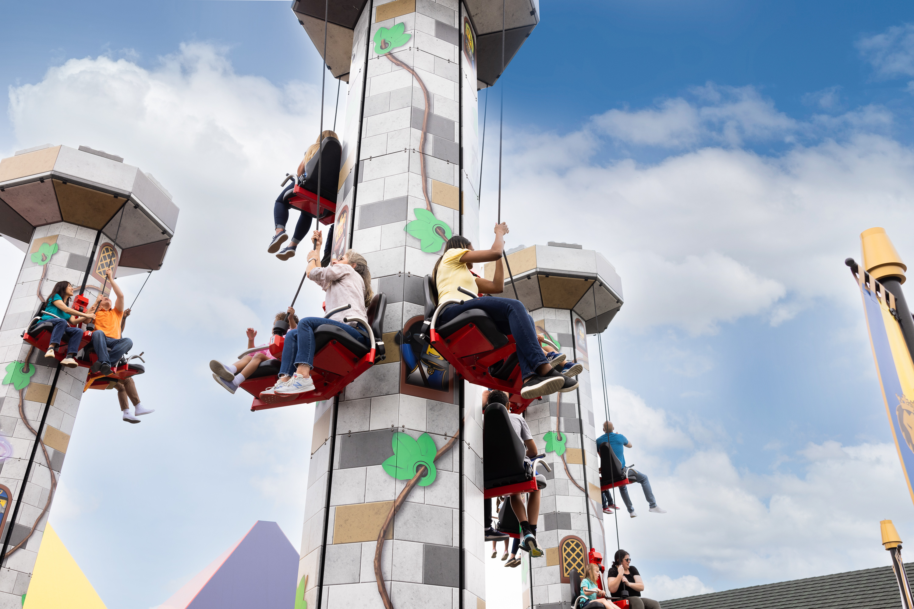 Guests hoist themselves to the top of Tower Climb
