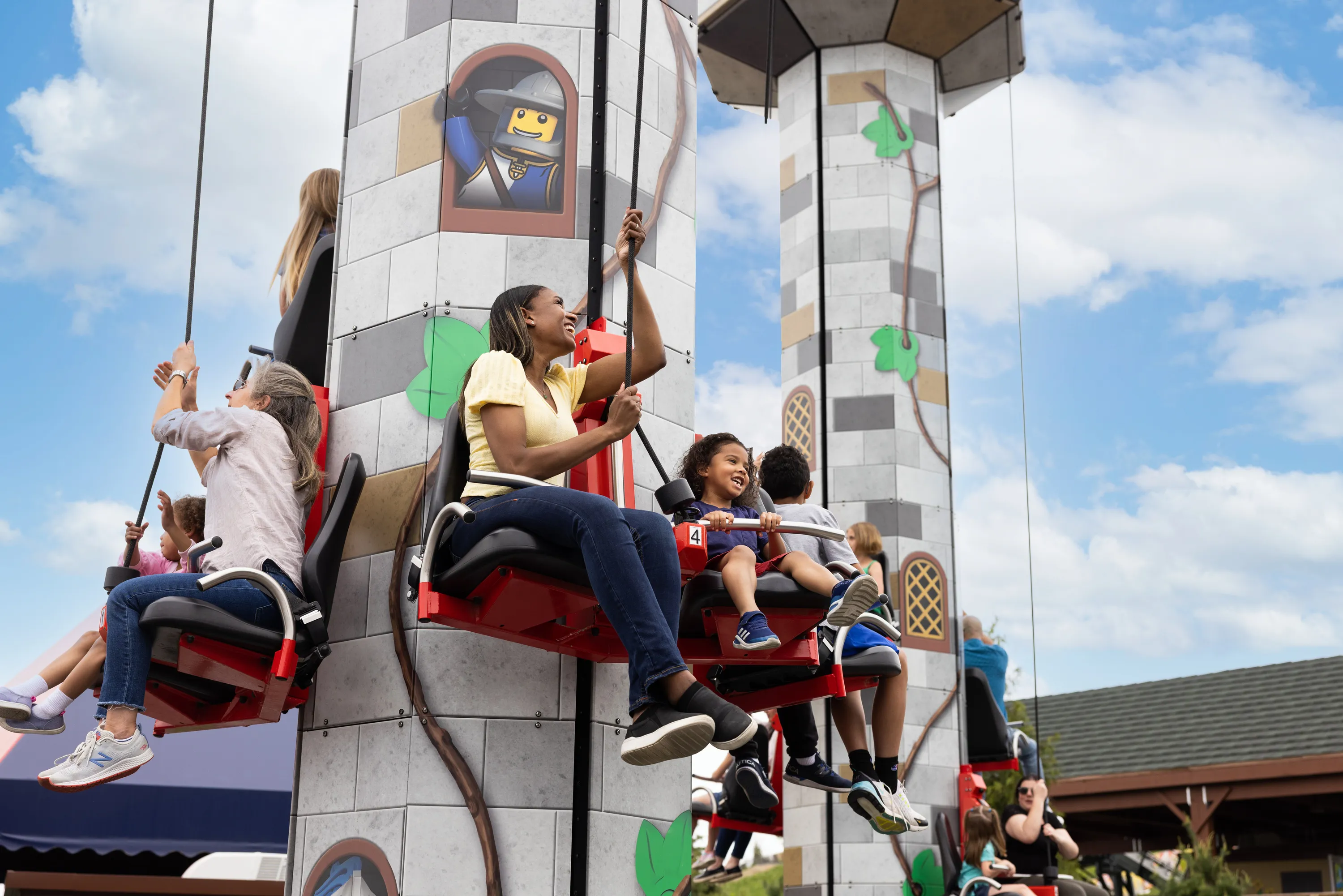 Guests hoist themselves to the top of Tower Climb