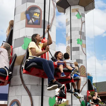Guests hoist themselves to the top of Tower Climb